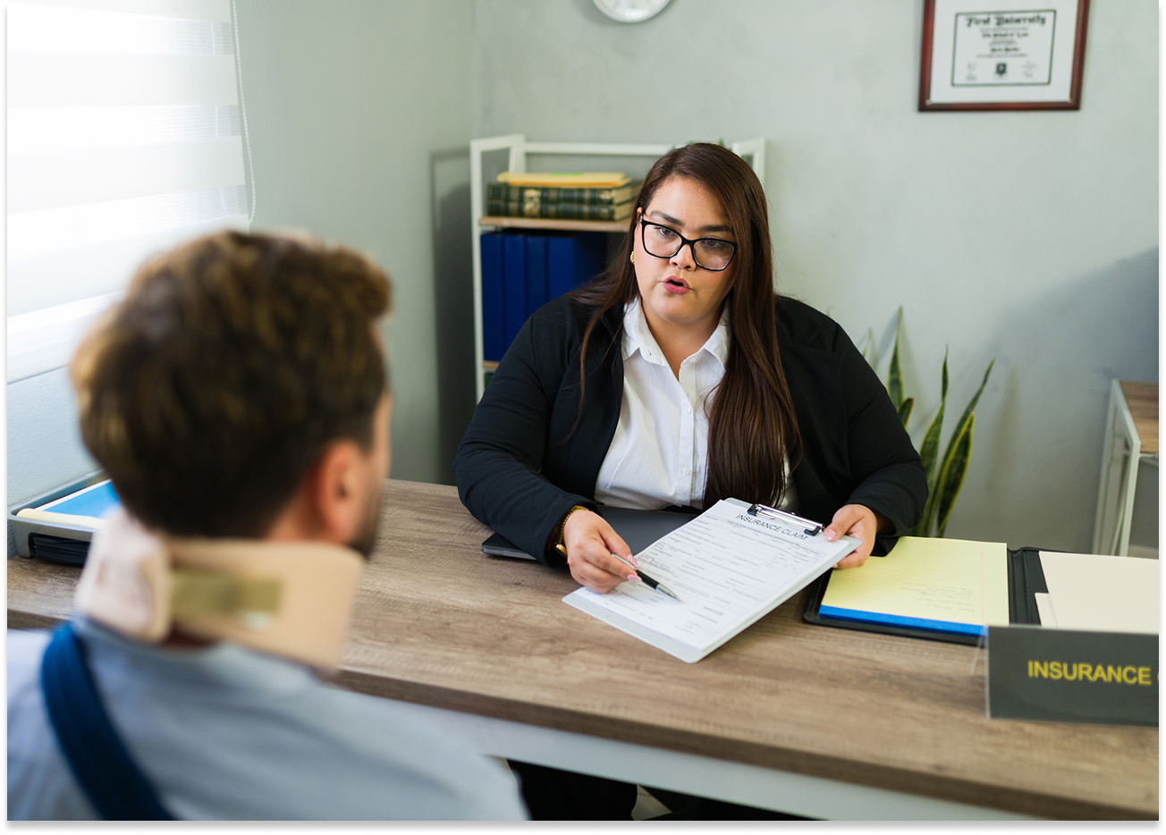 Insurance agent discussing with injured client.